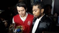 Kriss Hatta usai menjalani sidang di PN Bekasi, Senin (24/6/2019). [Ismail/Suara.com]