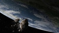 Ilustrasi asteroid melesat di dekat Bumi (Shutterstock).