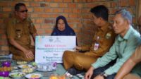 Penjabat Bupati Kabupaten Muaro Jambi Drs. Raden Najmi meresmikan bantuan Bedah Rumah di Desa Tunas Mudo Kecamatan Sekernan dan Desa Sembubuk Kecamatan Jambi Luar Kota