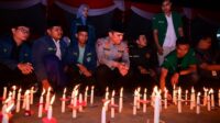 1000 lilin di doa bersama dan aksi damai polda jambi
